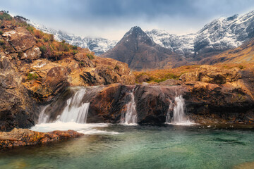 beautiful waterfalls Fairy Pools under the snowy mountains