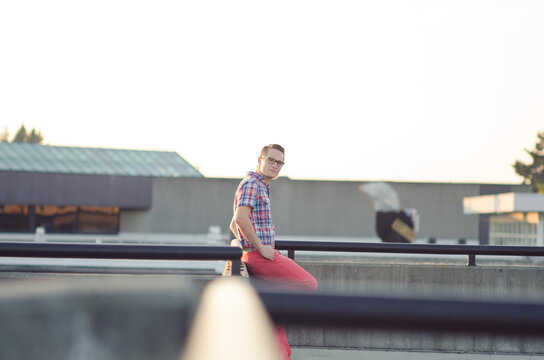 Young stylish man on rooftop with plaid shirt