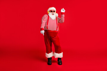 Fototapeta na wymiar Full length body size view of his he handsome bearded fat overweight cheerful funny Santa fan listening melody dancing having fun isolated bright vivid shine vibrant red color background