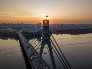 Aerial drone view. Automobile North Bridge in Kiev at sunset.
