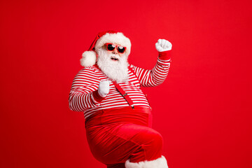 Portrait of his he nice handsome attractive cheerful cheery glad thick gray-haired Santa festal bargain celebration dancing isolated over bright vivid shine vibrant red color background