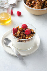 Diet dessert with yogurt, granola and fresh berries.