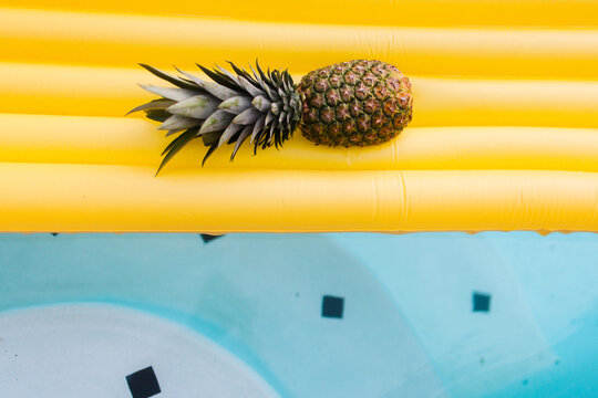 Pineapple Floating in Pool