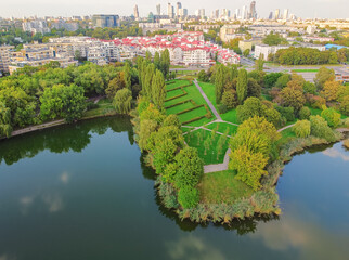 Park with large lake in the big, capital city. Drone, aerial view