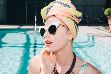 Chic girl by the pool.