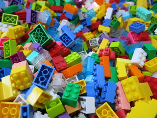 lots of colorful plastic cubes are on the playground for building something creative