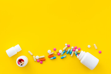 Pills bottle with medicines and vitamins, view from above