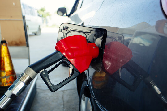 pumping gasoline fuel in car