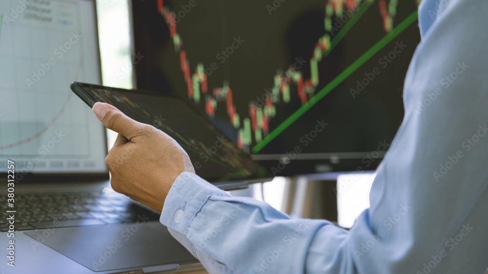Poster stock exchange trader working with graphs,diagrams on monitor in modern trading office