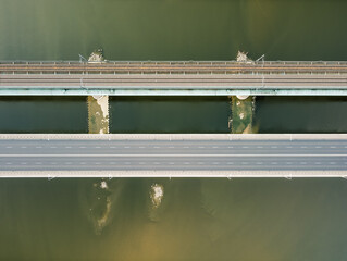 Top down view on a car and train bridge. Drone, aerial view.