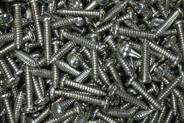 Close up shot of stainless steel screw pile in a toolbox for spare part  in industrial concept