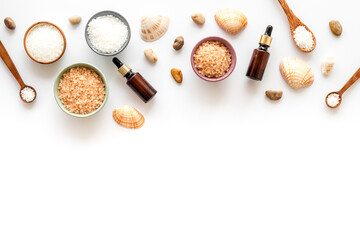 Frame of sea spa salt in bowl and bath set top view