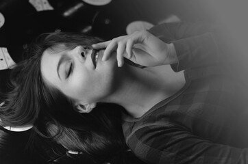 girl lying on the floor in vinyl records
