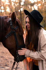 girl with a horse in the forest