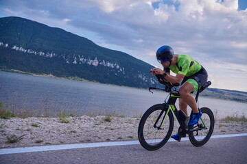 Fototapeta premium triathlon athlete riding bike