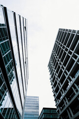 Fototapeta premium Background of tall skyscrapers seen from below