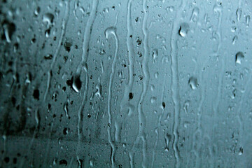 Foggy glass with falling drops