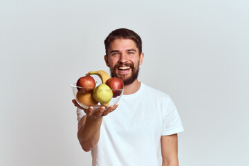 man with fresh fruit in a glass cup gesturing with hands vitamins health energy model bushy beard...