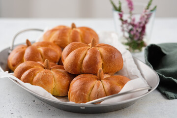 Pumpkin buns bread on grey background. Halloween Food Concept. Autumn concept.
