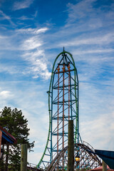 Roller coaster against a deep blue sky