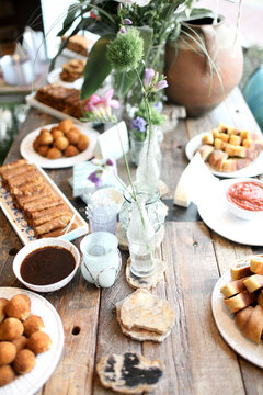 Rustic buffet table with vintage floral centerpieces