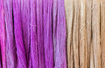 Closeup colored raw cotton thread background, natural material, natural dye cotton thread in Thailand