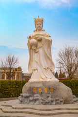 Fototapeta na wymiar Mazu is a Chinese sea goddess, adjacent to Tianhou Temple at Guwenhua Jie street in Tianjin, China