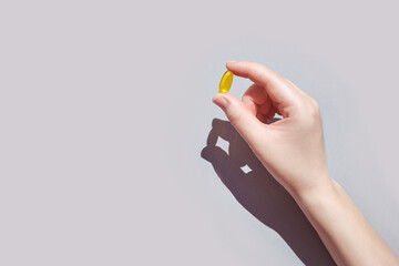 Omega3 gel capsule. Yellow vitamin. Health eating. Dietology. Fish oil supplement. Microdosing...