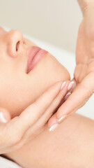 Beautiful portrait on white background. Cosmetology massage. Young woman facial medical treatment. Skin care concept. Nature people. Beauty spa salon. Face mask procedure. Healthcare rejuvenation