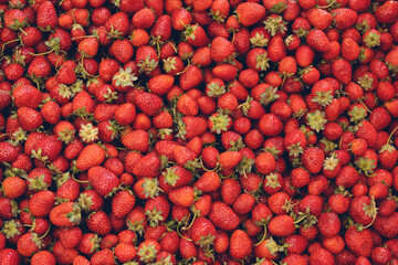 Natural background of red strawberries on the table ready to eat