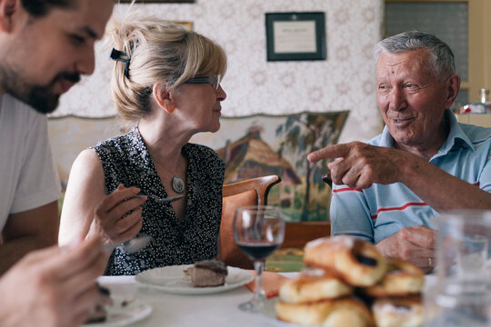 Family enjoying dessert after lunch