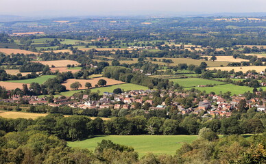 Fototapeta na wymiar English rural landscape from the Malvern hills in UK, looking over the Village of Colwall in Worcestershire and towards Herfordshire