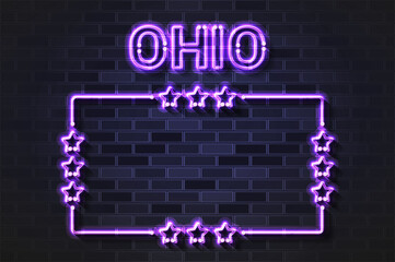 Ohio US State glowing violet neon letters and starred frame on a black brick wall