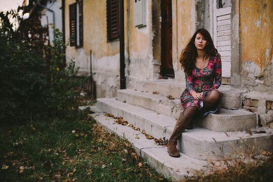 Beautiful young woman in floral print dress.