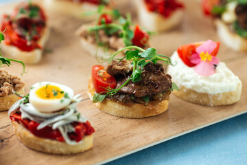 Closeup on assorted tapas with different toppings 