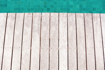 Backgroung of swimming pool and wooden deck.