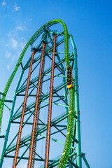 Roller coaster against a deep blue sky