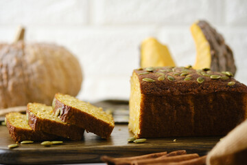 Gluten Free Pumpkin bread loaf set white cafe table.