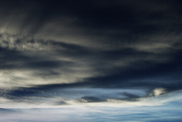 Natural toned emotional day sky background. Heavy cloud formation in stormy dark sky, strong wind and hard rain.