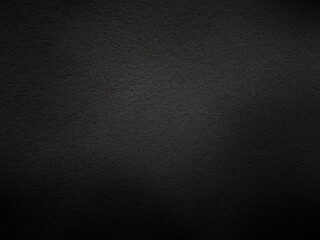 Emotional dot texture of old cement wall in the dark. Low light image frame with copy space for...