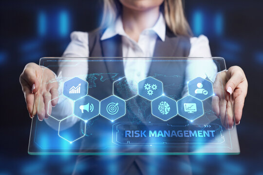 Business, Technology, Internet and network concept. Young businessman shows the word on the virtual display of the future: Risk management
