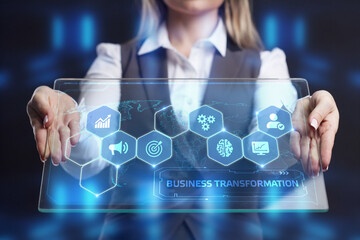 The concept of business, technology, the Internet and the network. A young entrepreneur working on a virtual screen of the future and sees the inscription: Business transformation