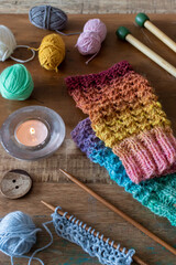 Obraz na płótnie Canvas hand knit fingerless gloves made with self striping yarn 