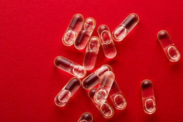 Many red capsules on deep red background