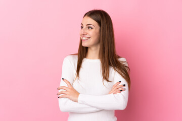Young woman over isolated pink background happy and smiling