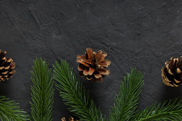 Christmas decoration on dark concrete with copy space. Xmas background. 