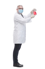 Fototapeta na wymiar in full growth. doctor in a protective mask looking at the test results . isolated on a white backgro