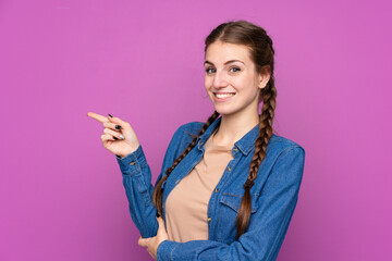 Young woman over isolated purple background