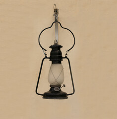 Oil Lamp Hanging on Vintage Wall
