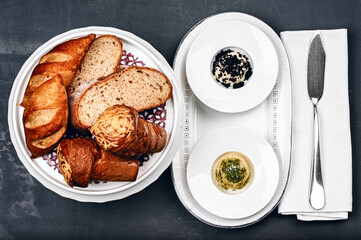 Freshly baked homemade assorted bread and bun traditional breakfast with spicy butter